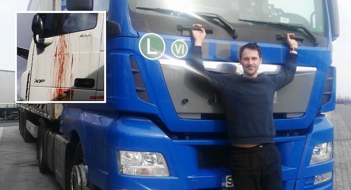 Mihai Spataru delante de un camión de los que conducía habitualmente para la empresas española para la que trabajaba como conductor de transporte internacional.